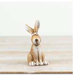 A cheerful rabbit ornament with big eyes and a smiling face.