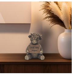 Adorable Highland cow decoration, perfect for adding rustic charm to your space.