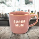 a lovely little mug featuring the wording super mum 