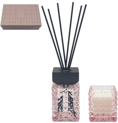 Experience luxury with this elegant diffuser and candle set for a soothing ambiance.