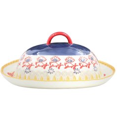 Add a charming, hand-painted touch to your kitchen with this elegant butter dish