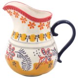 Charming ceramic jug with hand-painted white, yellow, and orange flower