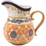 A hand-painted jug bursting with vibrant colours and exquisite craftsmanship