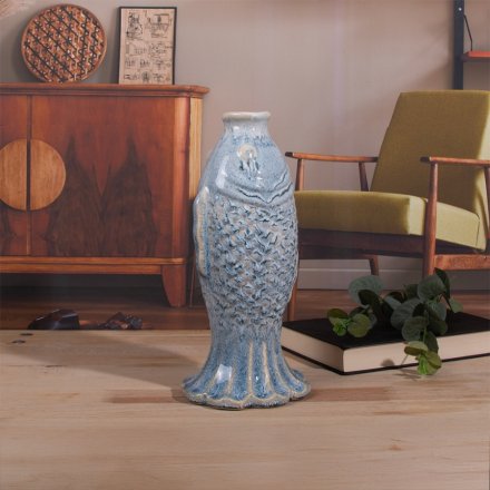 A delightful reactive glaze vase, perfect for showcasing your favorite blooms.