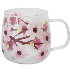 Trendy glass coffee mug featuring a beautiful blossom flower pattern.