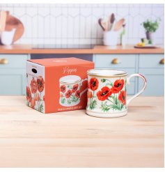 A trendy candle in a mug featuring a charming poppy pattern.