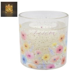 Brighten your room with the glowing charm of the Sparkle Flower Mum Candle.