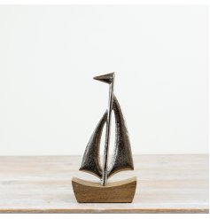 Chic ship figurine displayed on a base ornament.