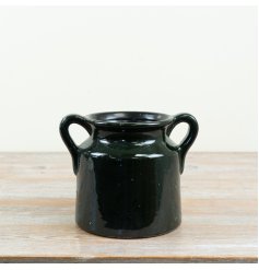 add a touch of nature to your home with this stunning green handles panter 