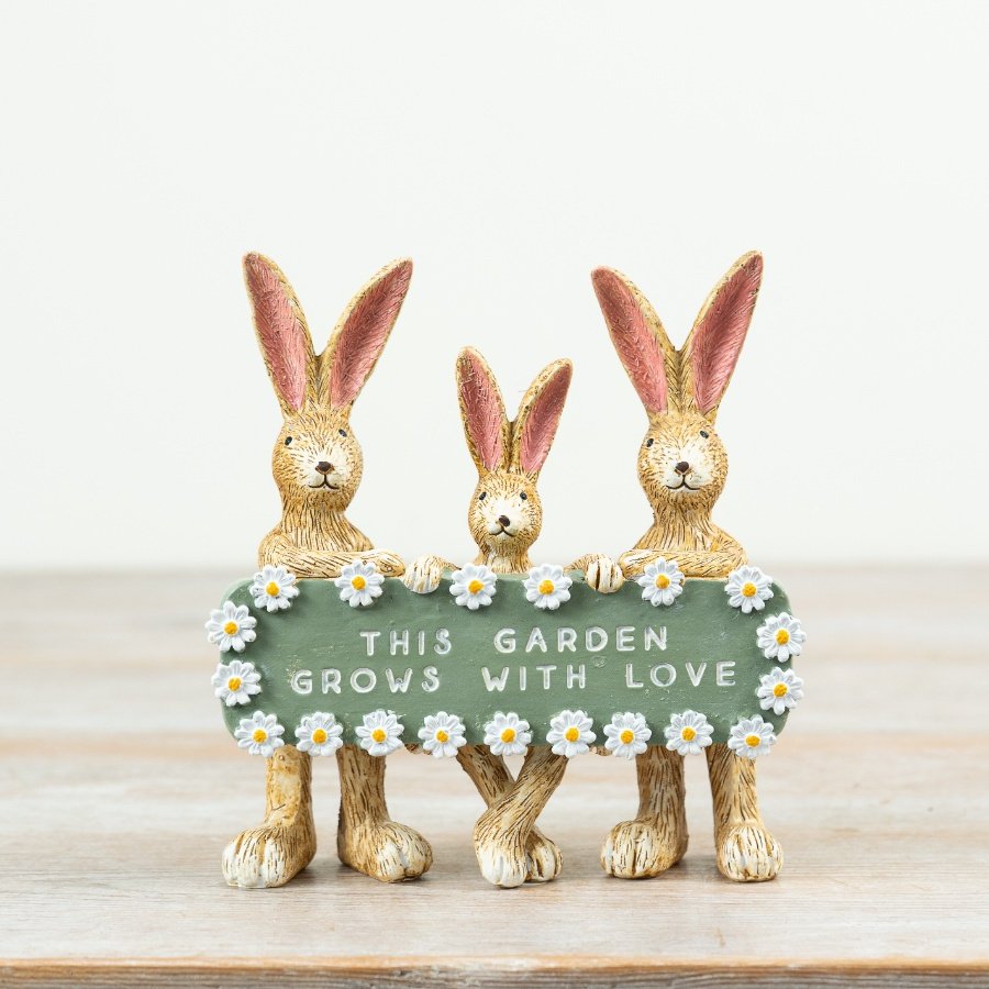Charming rabbit family ornament: This garden blooms with love and warmth.