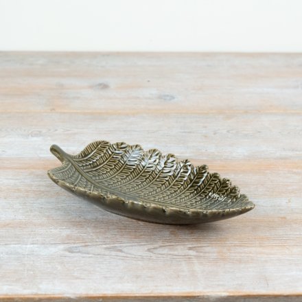 Chic leaf-shaped trinket dish for stylish storage.