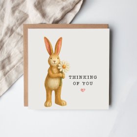 Share warmth and care with our Thoughtful Rabbit "Thinking of You" Greeting Card.