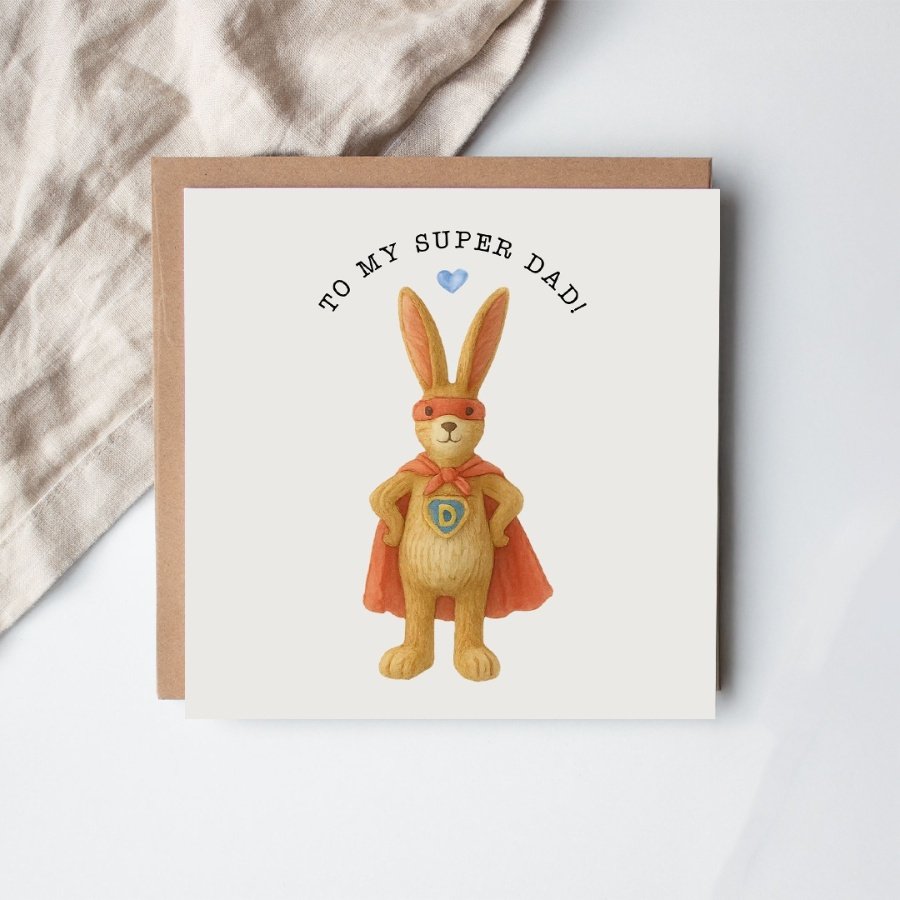 Celebrate your super dad with the charming Super Dad Jasper Rabbit Card—featuring a sweet brown rabbit holding a white