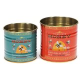 Keep your treats fresh and stylish with this set of 2 honey-themed mini storage tins