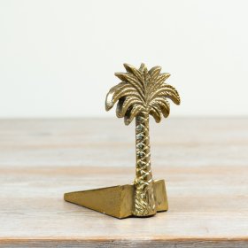 Hold doors open with flair using the Palm Tree Gold Door Stopper.