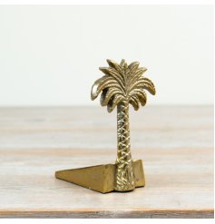 Secure doors in style with the Palm Tree Gold Door Stopper.