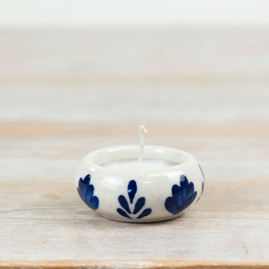 Illuminate your space with this stylish ceramic tea light holder, adding a warm and cozy touch.
