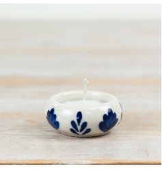 Brighten your space with this elegant ceramic tea light holder’s warm, charming glow.