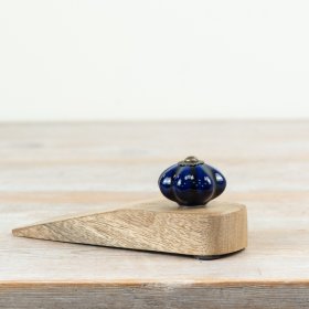 Chic door stopper crafted from ceramic and wood for a modern touch.