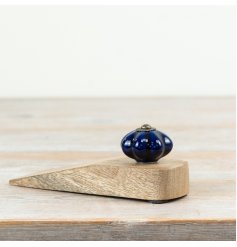 Chic door stopper crafted from ceramic and wood for a sleek, functional touch.