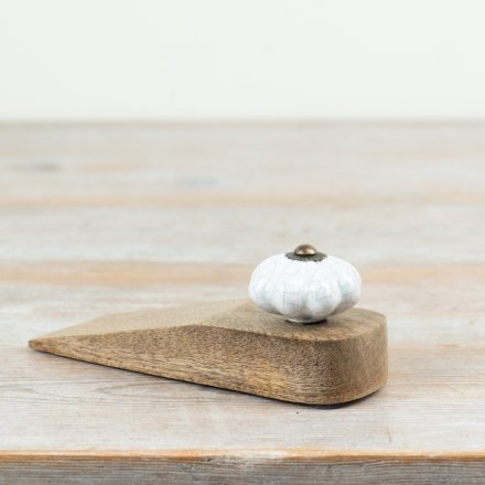 Elegant wooden doorstop expertly secures doors in place.