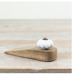 Elegant wooden doorstop expertly secures doors in place.