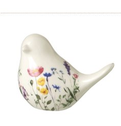 Meet this white bird with floral details, beautifully coated in a clear glaze.