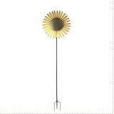 A tall sunflower garden stake that spins in the breeze.