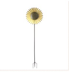 A tall sunflower garden stake that spins in the breeze.