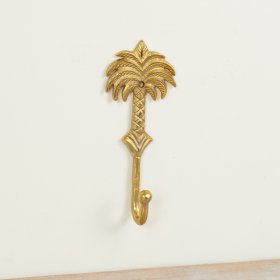 Bring tropical charm to your space with this elegant gold palm tree hook.