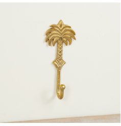 Add a touch of tropical elegance to your home with this gold palm tree hook.