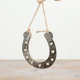 Elegant horseshoe hanger featuring a charming heart-shaped cutout design.