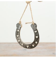 Horse shoe hanger featuring a chic cut-out heart design for a stylish touch.