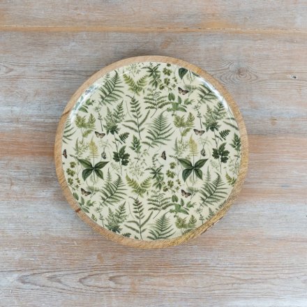 Round plate featuring a delightful fern pattern