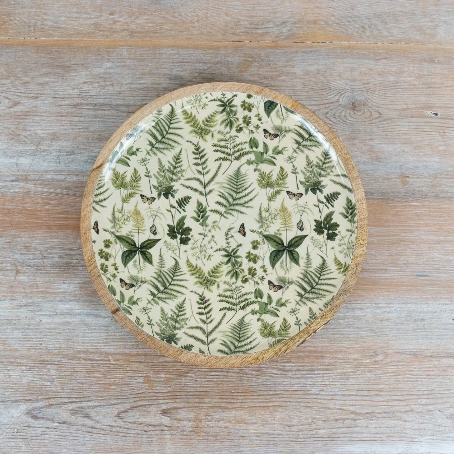 Round plate featuring a charming fern pattern
