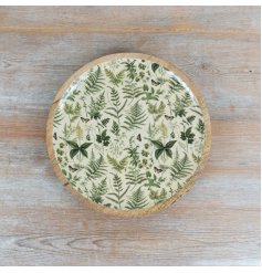 Round plate featuring a delightful fern pattern