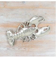 Add coastal charm with this chic lobster-shaped trinket dish.