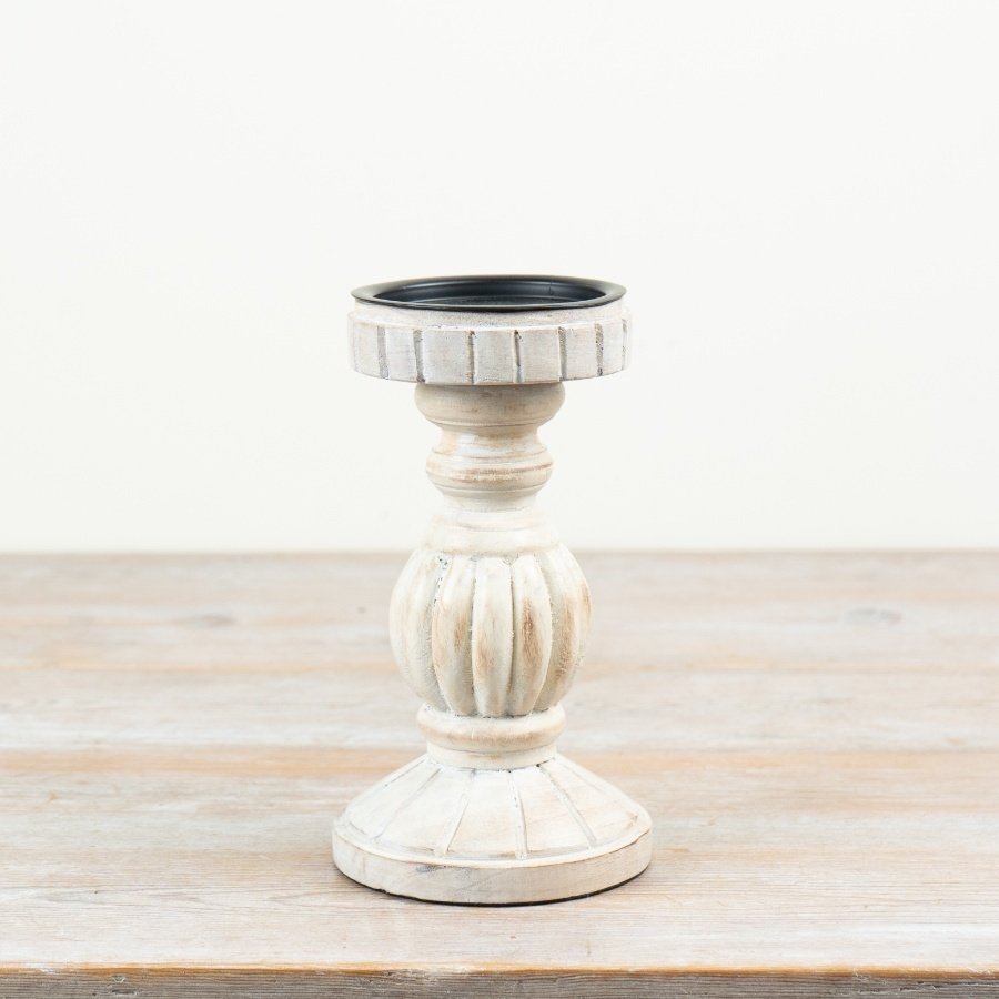 Elegant white candle holder with a modern design.