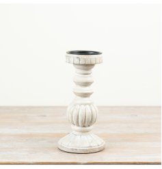 Chic candle holder featuring a durable build and a whitewashed lime-effect design.