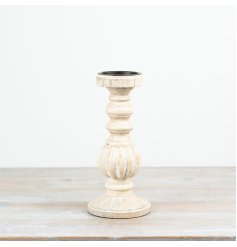 Tall whitewashed candlestick with a rustic, weathered finish.