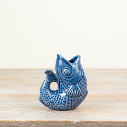 Beautiful blue fish-shaped vase with vibrant color and elegant design.