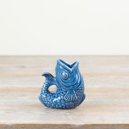 Porcelain jug in elegant navy blue with a fish design.