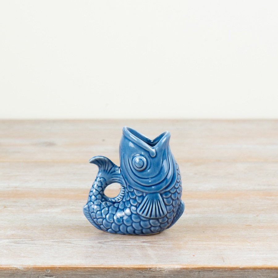 Porcelain jug in elegant navy blue, perfect for serving with style.