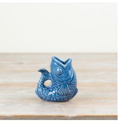Porcelain jug in elegant navy blue with a fish design.
