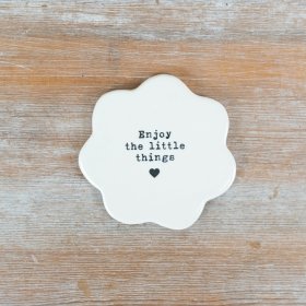 Savor the small joys with this stylish porcelain flower coaster.