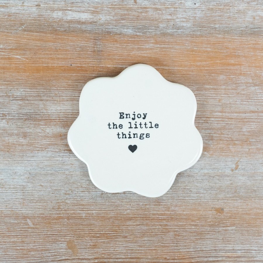 Savor the small joys with this stylish porcelain flower coaster.