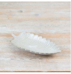 Elegant white porcelain plate shaped like a leaf.