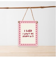 This pink metal dangler brings a bold, sassy touch and a hint of honesty to your home decor.