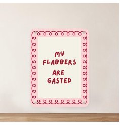 A playful, vibrant pink metal sign with a quirky design.