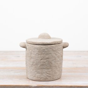 Add a chic touch to your living area with this stylish stone-textured decorative pot.